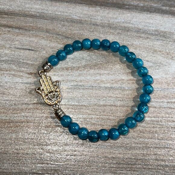 Light Blue Bead Stretch Bracelet with Gold Tone Hamza Hand - Picture 1 of 7